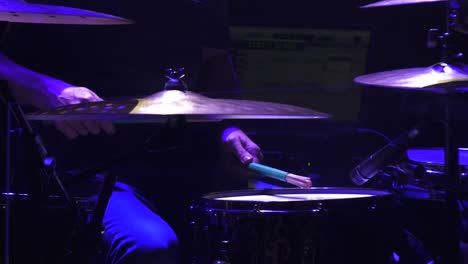 drummer performing on stage at a concert