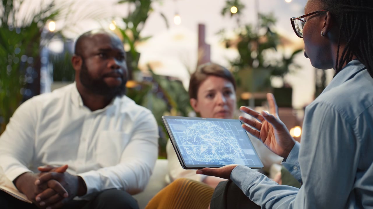 Close up of businesswoman using tablet to show investors how to leverage AI