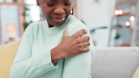 Shoulder-pain,-problem-and-black-woman-on-sofa