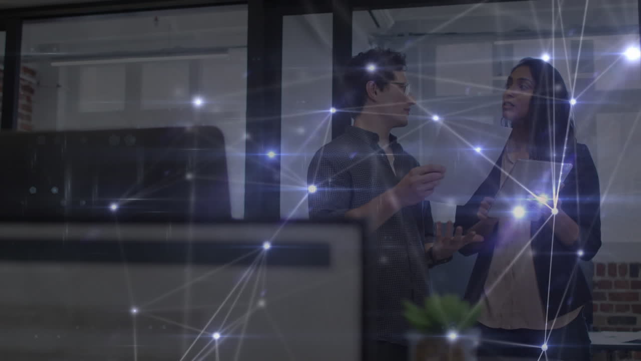 Network of connections against diverse office colleagues discussing together at office