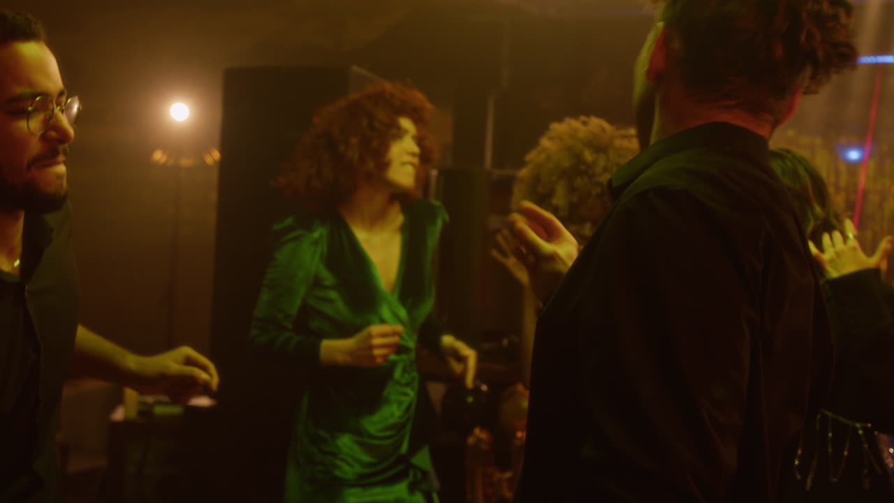 People dancing and having fun at a nightclub party