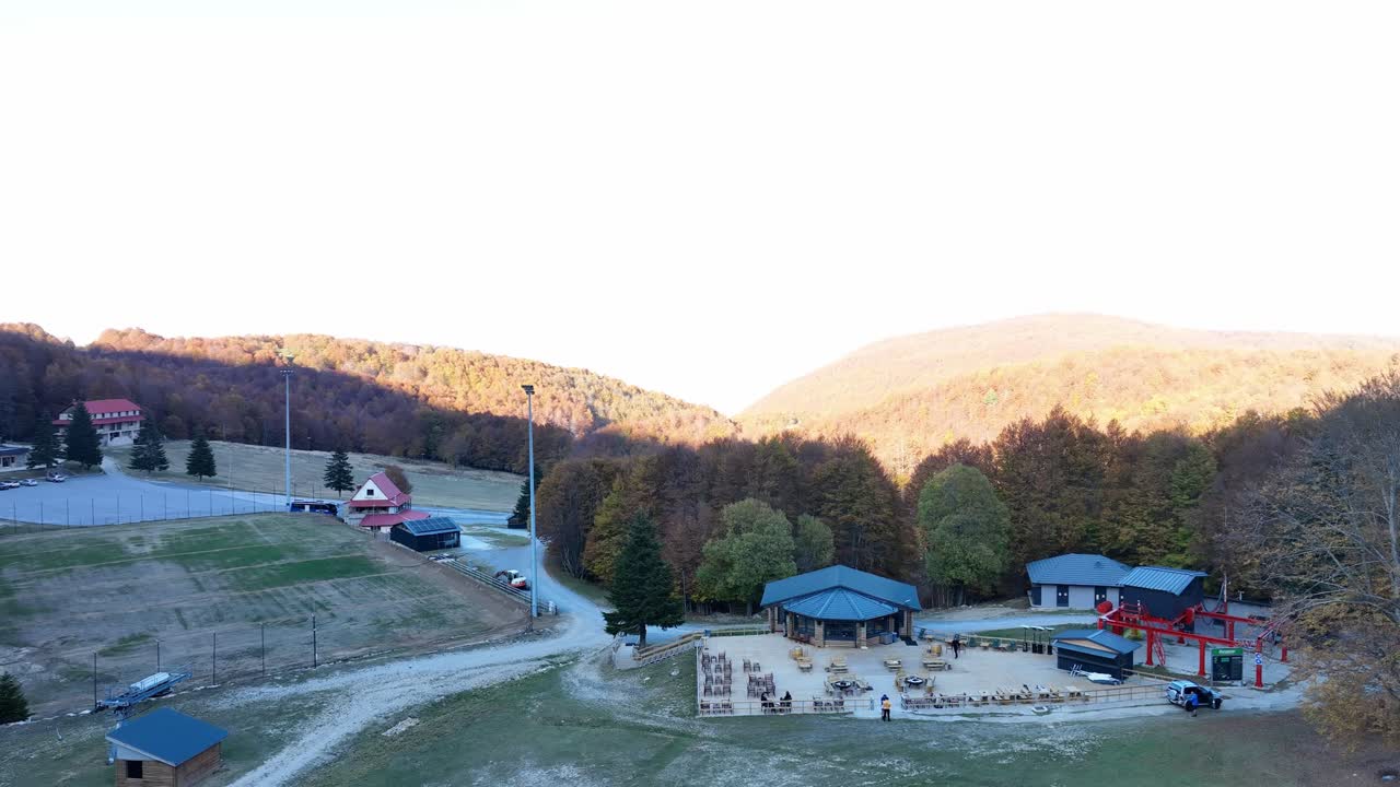 Aerial view of 3-5 Pigadia Ski Center on Mount Vermio, showing autumn foliage, lodges, and ski lift infrastructure. Greece