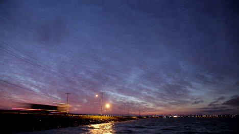 Beautiful-timelapse-sunrise-over-the-River-Paraguay-with-incredible-view-of-car-lights