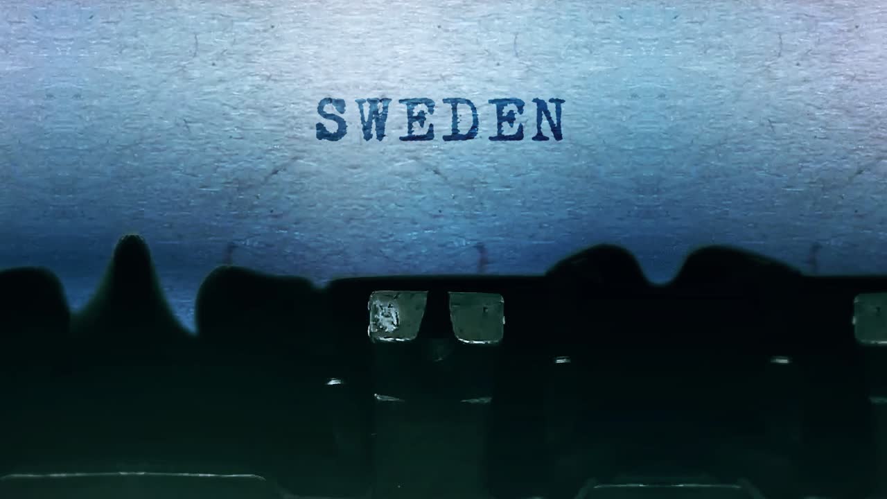 Sweden word closeup being typing and centered on a sheet of paper on old vintage typewriter