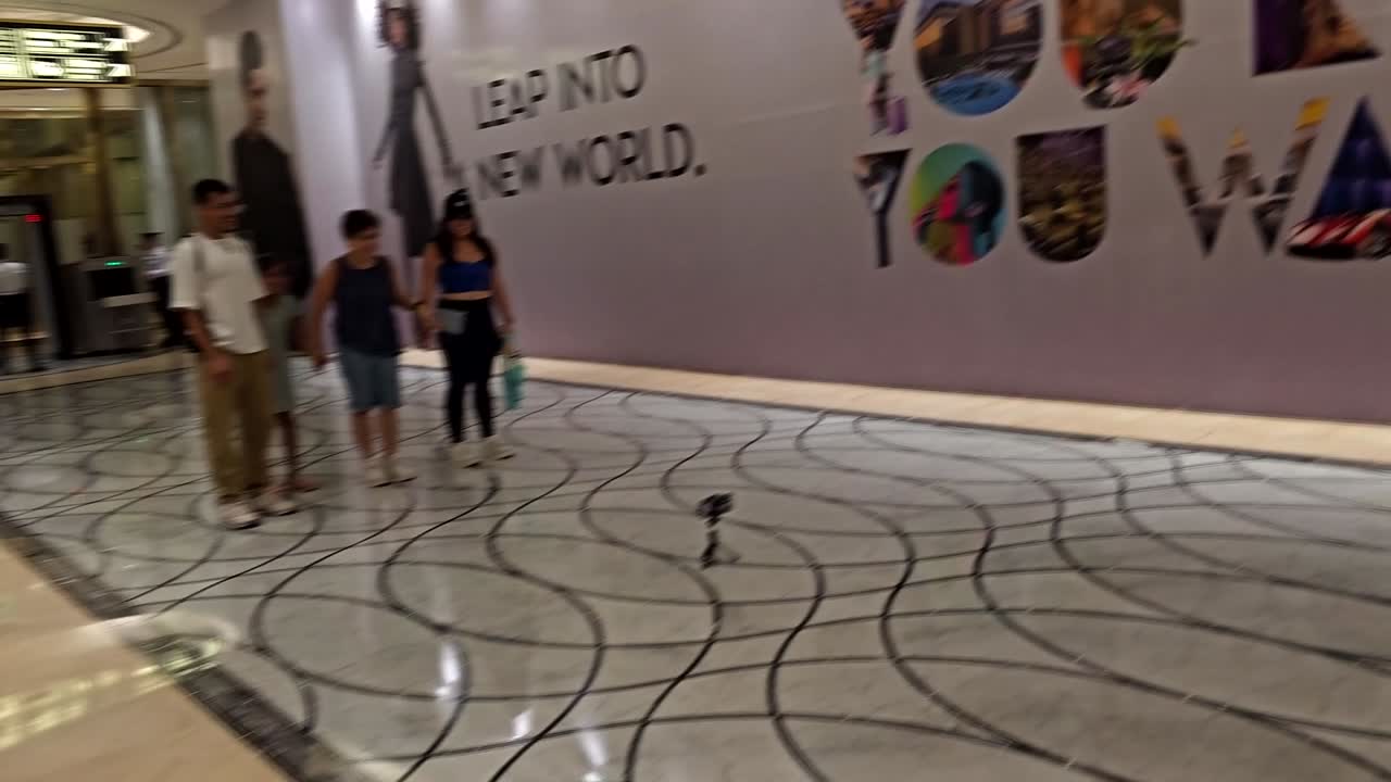 Family Walking Through Luxurious Casino Hotel Lobby