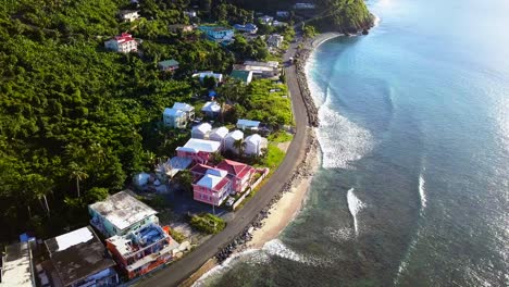 aerial pull back of local homes on british virgin island tortola on the beach