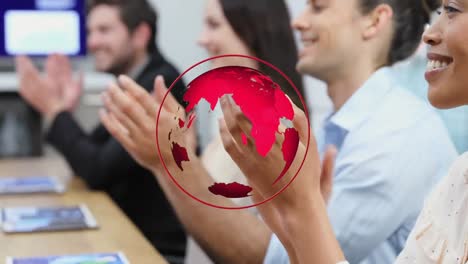 Animation-of-red-globe-over-diverse-colleagues-clapping-at-office-meeting