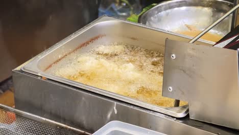 deep frying food in a commercial kitchen