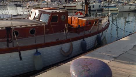 an old classic sailboat anchored in the palermo port, sicily