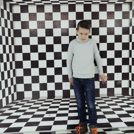 boy watching a whirlwind of optical illusion in the science center square video