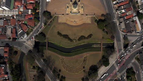 Zenith-shot-of-the-Ipiranga-Park-passing-over-the-creek-source-of-the-Ipiranga-River,-where-the-independence-of-Brazil-was-proclaimed-and-reaching-the-Independence-Monument