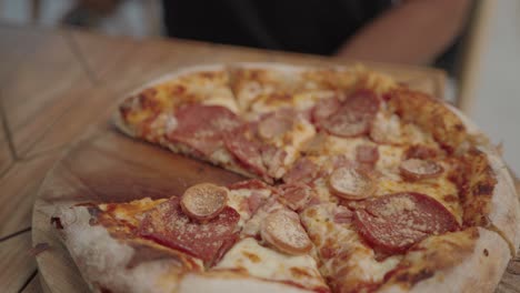 person eating a delicious pizza