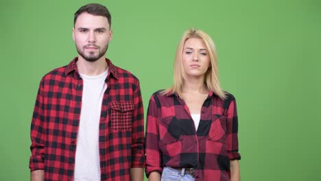 young couple with arms crossed together