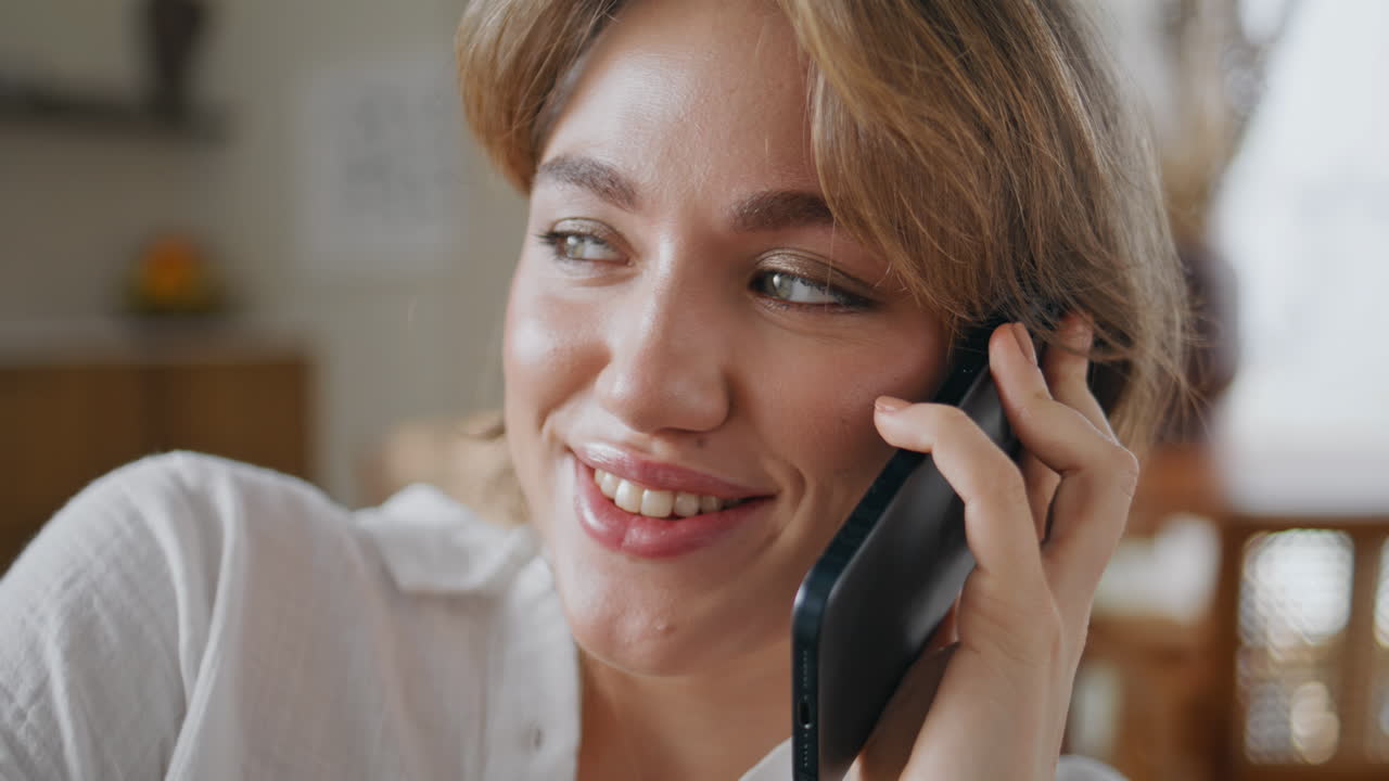Gossip woman talking phone sitting living room closeup. Attractive lady call