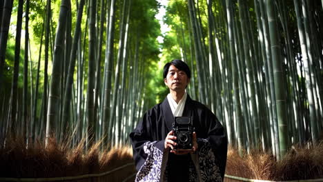 man in traditional clothing at a bamboo forest