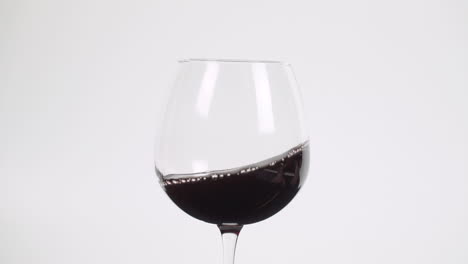 Swirling-red-wine-in-burgundy-glass