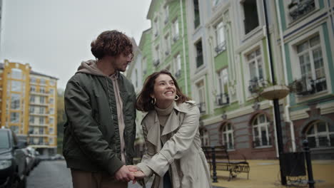 Love-couple-holding-hands-outdoor.-Man-and-woman-kissing-on-urban-street.