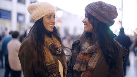 two stylish young women in winter fashion