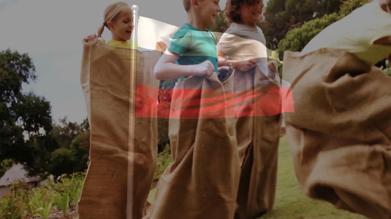 Participating in sack race, children with Polish flag animation in school event