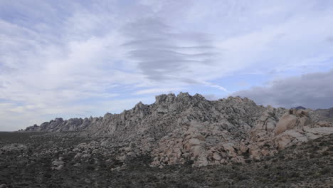 time lapse of storm clouds over the granite mountains in mojave national preserve california