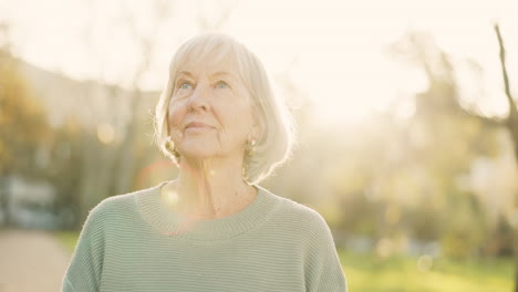 Senior-woman,-relax-and-thinking-outdoor-in-a-park