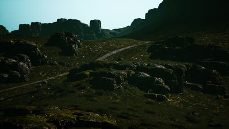 a rocky path winds up a mountainside