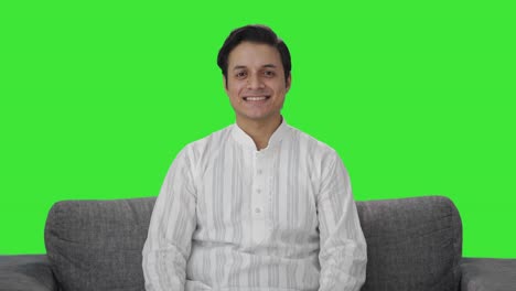 happy indian man smiling to the camera green screen