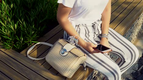 attractive woman sitting on bench swing