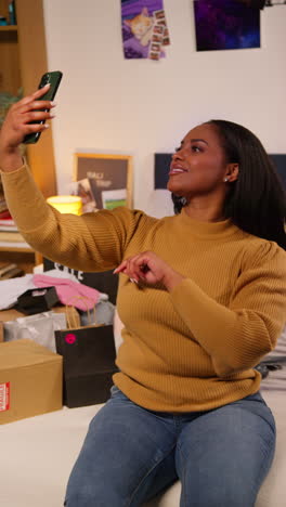 woman taking a selfie in her bedroom