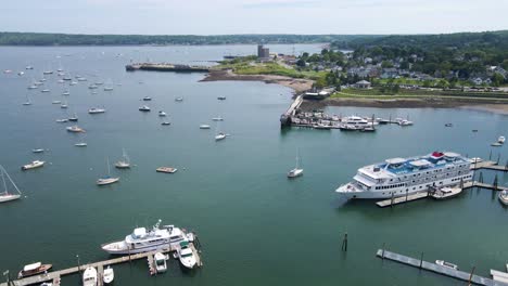 boats docked at rockland harbor in maine | aerial view panning across | summer 2021