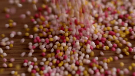 colourful sprinkles pouring onto surface