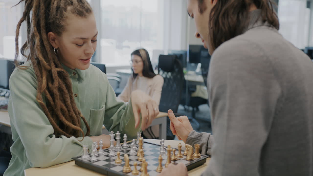 People Playing Chess in an Office