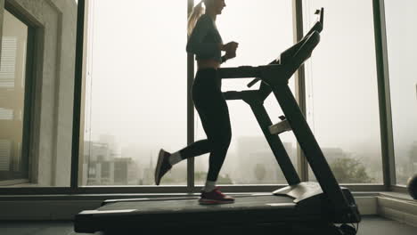 Running,-fitness-and-woman-on-treadmill-at-gym