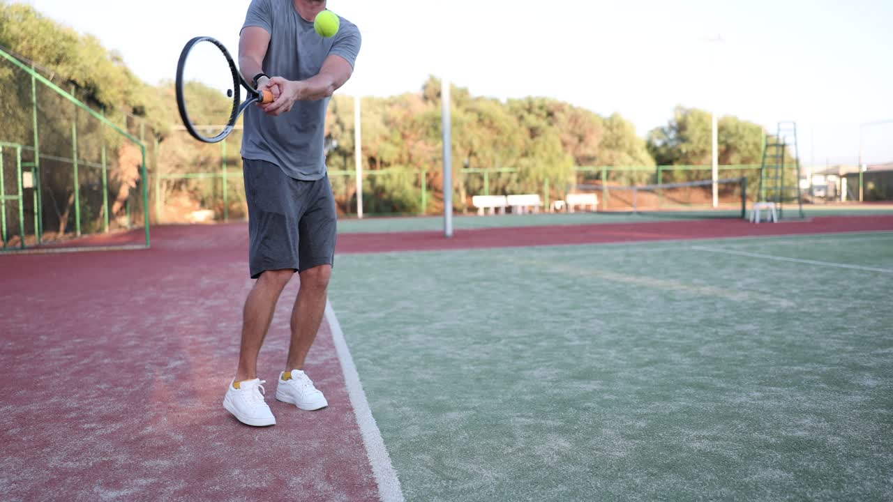 A tennis player playing tennis on a court