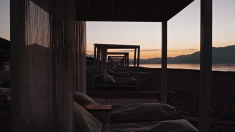 Dollyshot-backwards-through-beach-lounges-in-Greece