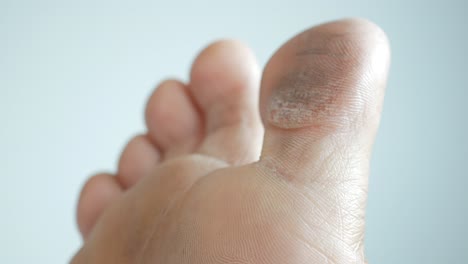 Close-up-of-young-men-dry-feet-on-bed