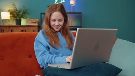 happy preteen girl making video webcam conference call with friends or family enjoying conversation
