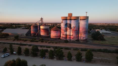 Wide-shot-toward-colourful-art-silo-Sea-lake-sunrise,-Victoria-Australia