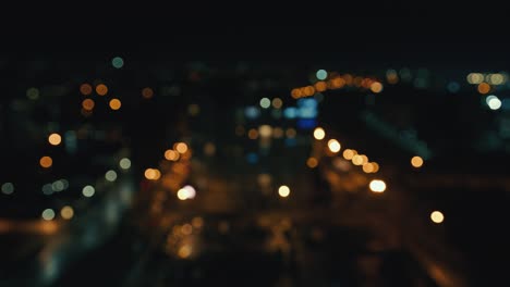 blurred night city background with colored bokeh. view of the city from a height out of focus