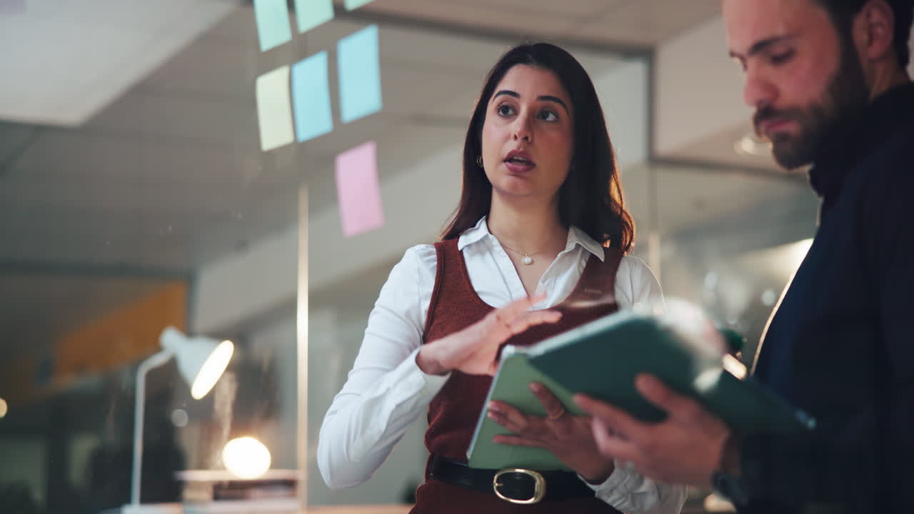 Business professionals collaborating on a project in the office