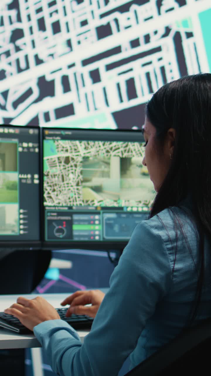 Woman Monitoring City Traffic on Multiple Surveillance Screens