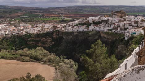 Tilt-up-time-lapse-over-beautiful-village-of-Arcos-de-la-frontera-in-Andalusia,-Spain