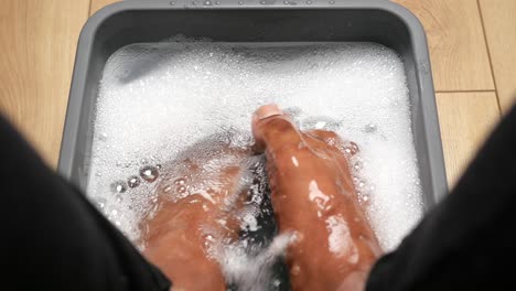 soaking feet in a foot spa