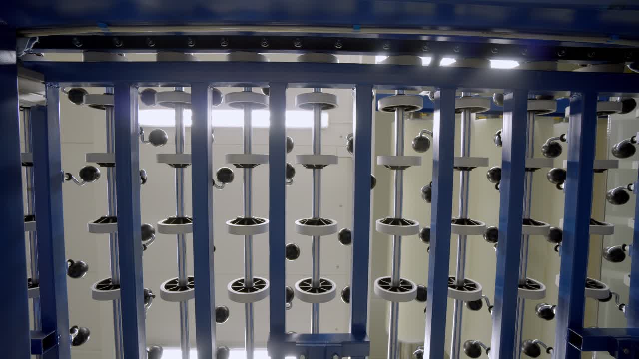 Rotating disc machine in motion seen from underneath, industrial setting