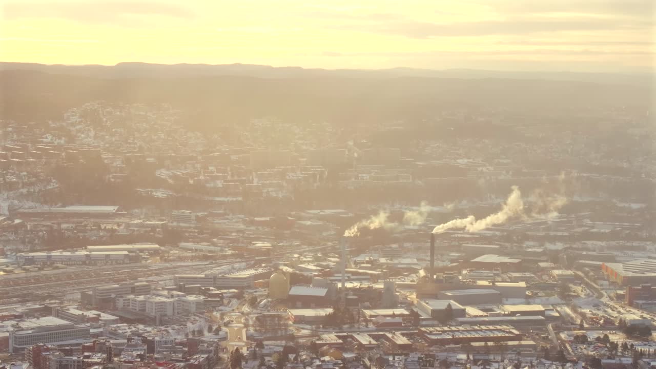Winter Oslo Norway Norge aerial view drone sunrise sunset industrial industry power plant haystack smoke cooling towers city landscape location buildings golden yellow clear skies cold static shot