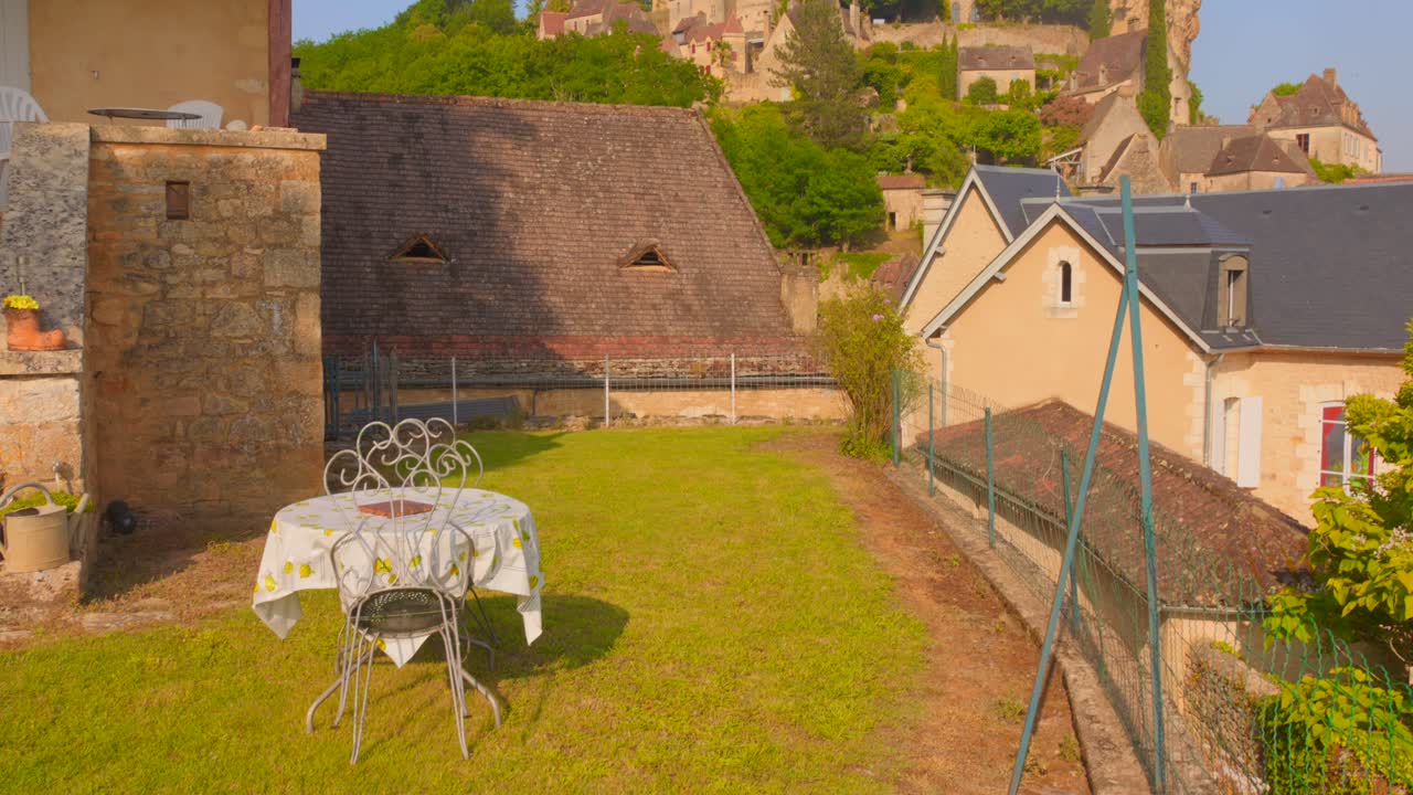Sunny view of Beynac's old houses under castle in beautiful village, France