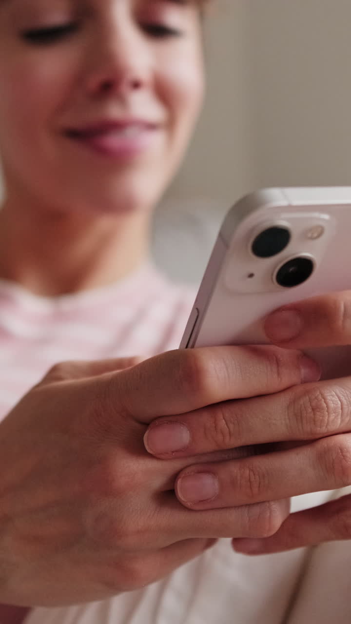 Happy Woman Using Phone on Sofa