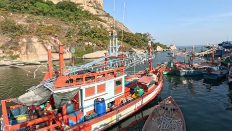 boat moving through crowded dock area