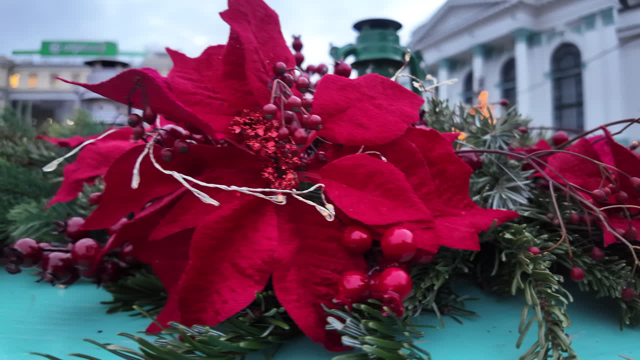 Red christmas decorations with fir tree branch in the evening