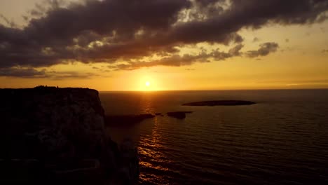 time-lapse of the sunset in cape cavalleria lighthouse menorca island spain